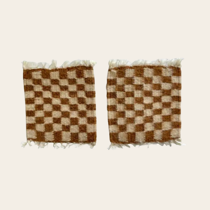 Handwoven checkered brown and cream wool coasters made in Oaxaca, Mexico