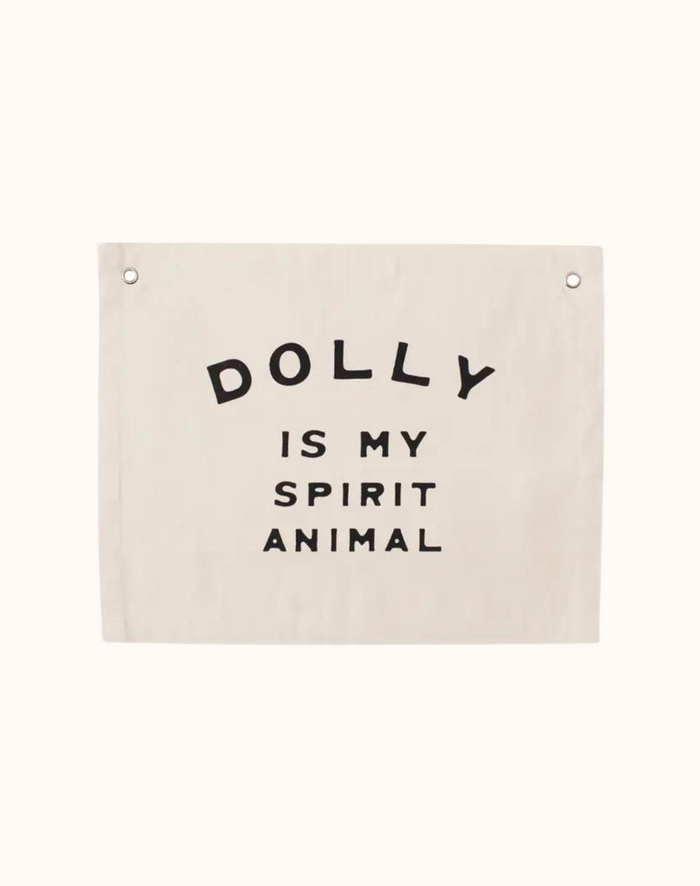 Canvas banner with black text that says "Dolly Is My Spirit Animal"