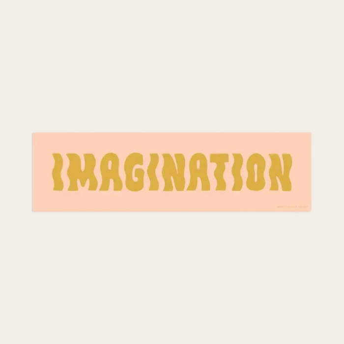 Imagination sticker with yellow text on pink background