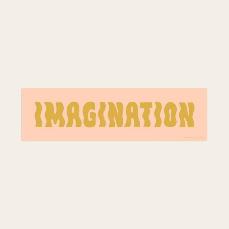 Imagination sticker with yellow text on pink background