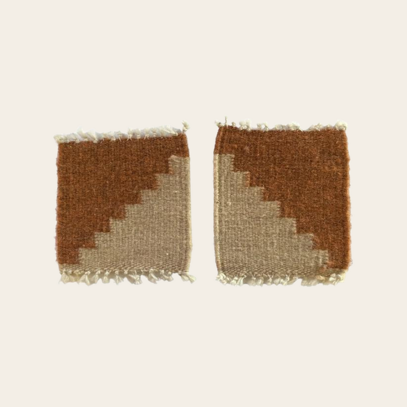 Handwoven clay and cream wool coasters made in Oaxaca, Mexico