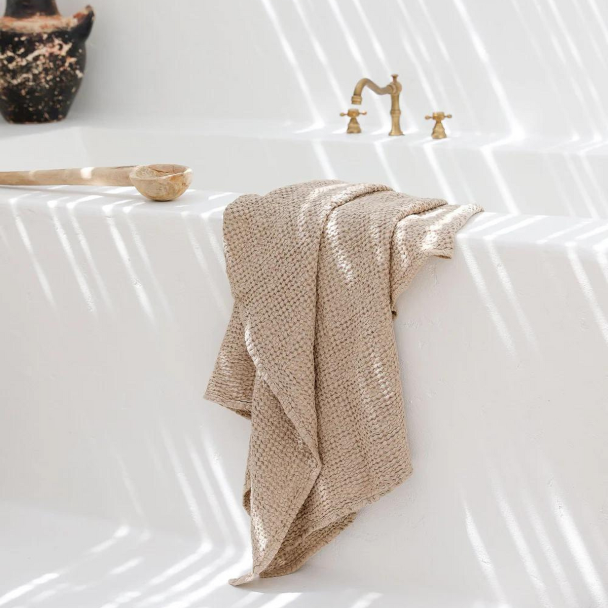 Towel laying on bathtub